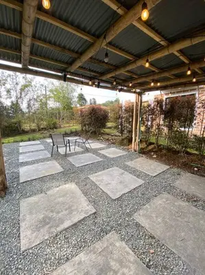 a covered patio with a bench and a table at Casa de Campo completa ubicada en Santa Elena in Santa Elena