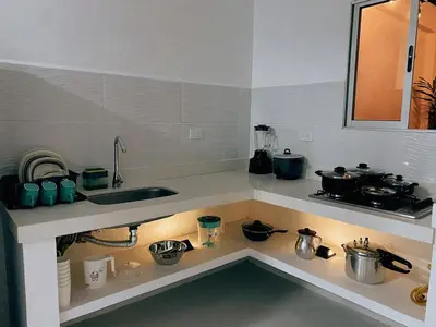 a kitchen with a sink and a counter top at Casa de Verano Altos de la Colina-Doradal in Doradal