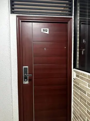 a wooden door with the number on it at Hermoso Apartamento Entero in Itagüí