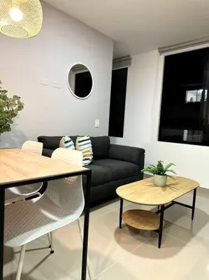 a living room with a couch and a table at Hermoso Apartamento Entero in Itagüí