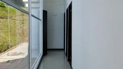 a glass door in a room with a window at Casa de Campo PREMIUN in Guatapé
