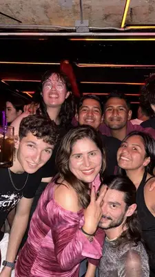 a group of people posing for a picture in a crowd at Lucca Hostel Medellín in Medellín
