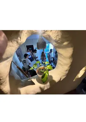 a view of a group of people in a kitchen at Lucca Hostel Medellín in Medellín