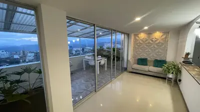 a living room with a view of the city at Hermoso apartamento en Manizales in Manizales
