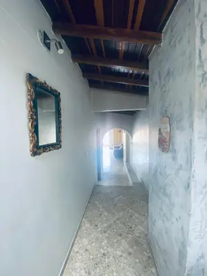 a hallway in a house with a mirror on the wall at Residencia Dual Retiro Urbano in Envigado