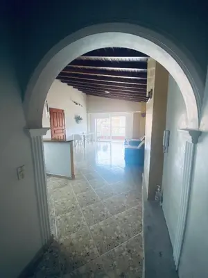 an empty hallway with an archway in a house at Residencia Dual Retiro Urbano in Envigado