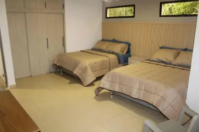 a bedroom with two beds in a room at Casa Primavera in El Poblado
