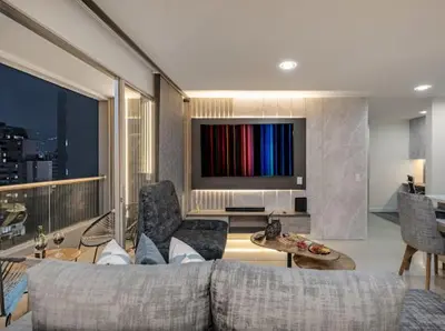 a living room with a couch and a flat screen tv at Apto nuevo, elegante y cómodo in Medellín