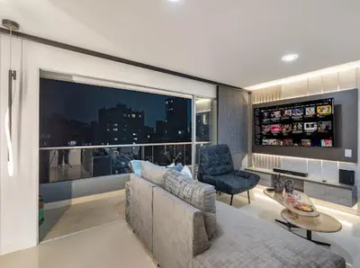 a living room with a couch and a chair at Apto nuevo, elegante y cómodo in Medellín