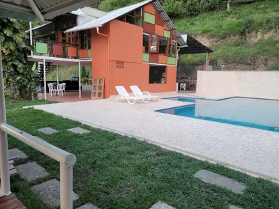 a house with a swimming pool next to a building at Finca Familiar Talena in Sopetran