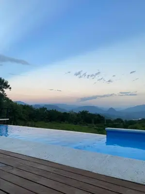 a swimming pool with a view of the mountains at Finca Calathea in Marsella