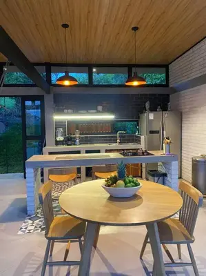 a kitchen with a table with a bowl of fruit on it at Finca Calathea in Marsella
