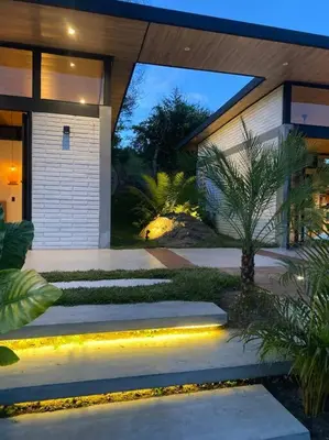 a house with a pathway in front of it at Finca Calathea in Marsella