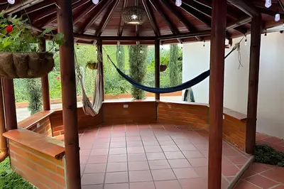 a room with a hammock in a gazebo at Casa Palos Altos; Poblado; 6 min de Provenza; in El Poblado
