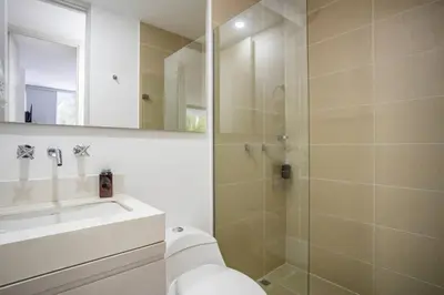 a bathroom with a shower and a toilet and a sink at Urban studios luxurious apartment in the poblado in Medellín