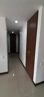 an empty hallway with a door in a building at Lujoso y Economico Apartamento in Envigado