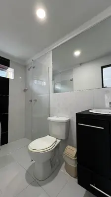 a bathroom with a toilet and a shower and a sink at Hotel Medellín 66 in Medellín