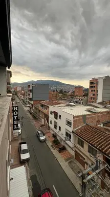 a view of a city with cars parked on a street at Hotel Medellín 66 in Medellín