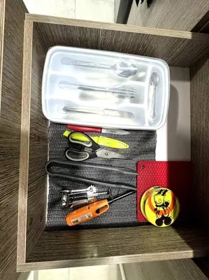 a drawer withrenches and other tools in it at El Tesoro Apto in Poblado in El Poblado
