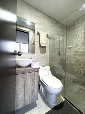 a bathroom with a toilet and a sink and a shower at El Tesoro Apto in Poblado in El Poblado