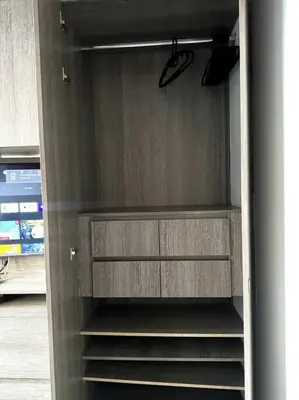 a refrigerator with its door open with its shelves at El Tesoro Apto in Poblado in El Poblado