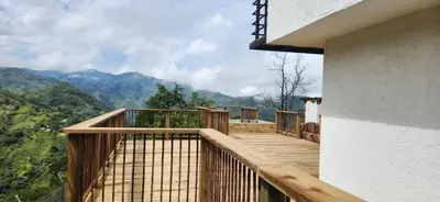a wooden balcony with a view of the mountains at Sedonascapes in Palmitas