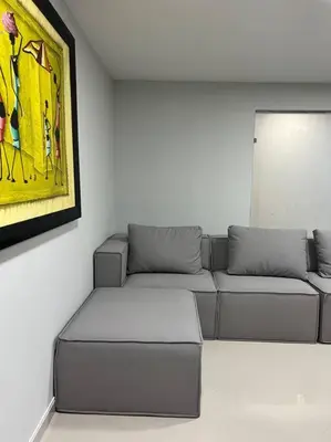 a living room with a couch and a painting at Apartamento Luxury Luxury apt in Medellín