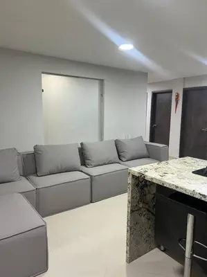 a living room with a couch and a table at Apartamento Luxury Luxury apt in Medellín