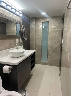 a bathroom with a sink and a shower and a toilet at Apartamento Luxury Luxury apt in Medellín
