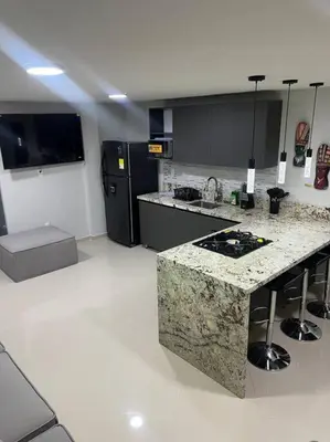 a kitchen with a marble counter top in a room at Apartamento Luxury Luxury apt in Medellín