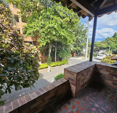 a brick bench on the side of a building at Casa luz in Medellín