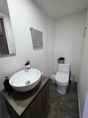 a bathroom with a sink and a toilet at Dúplex con hermosa vista a la ciudad deck exterior in Itagüí