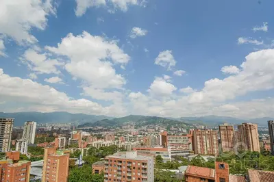 a view of a city with buildings and mountains at Charming Decor & Stunning Views Green Poblado in Medellín