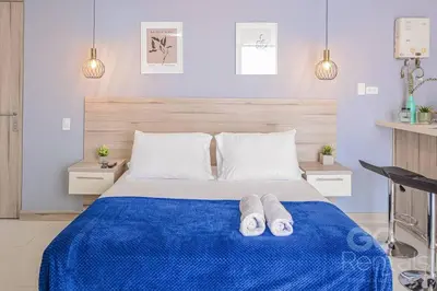 a bedroom with a blue bed with two towels on it at Charming Decor & Stunning Views Green Poblado in Medellín