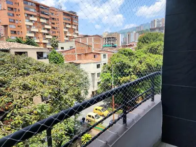 a view of a city from a balcony at Vivienda Céntrica y Acogedora in Sabaneta