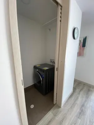 a door leading into a room with a microwave at Excelente ubicación y vista in Manizales
