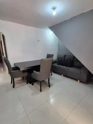a dining room with a table and a couch at Apartamento Super Exclusivo in Medellín