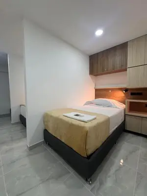 a bedroom with a large bed in a room at Vida Hostel in Medellín
