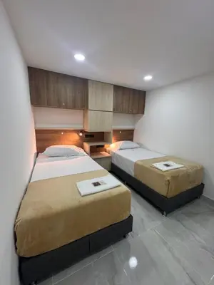 a bedroom with two beds in a room at Vida Hostel in Medellín