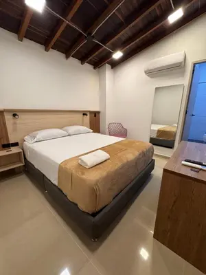 a bedroom with a large bed in a room at Vida Hostel in Medellín