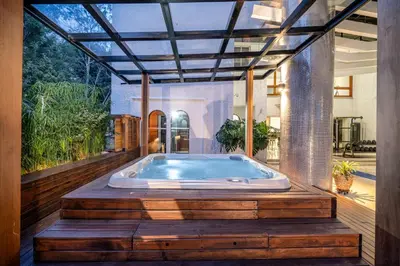 a jacuzzi tub in the middle of a house at Stunning Luxury Penthouse with SPA and Concierge in Medellín