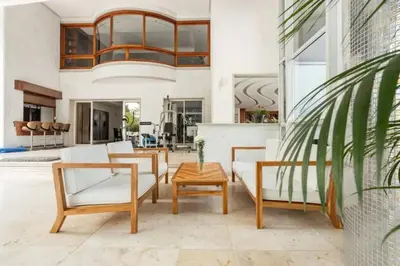a living room with white furniture and a chandelier at Stunning Luxury Penthouse with SPA and Concierge in Medellín