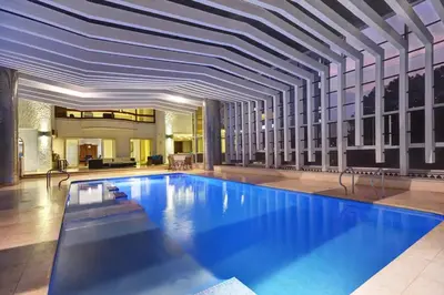 a large swimming pool in a building with a ceiling at Stunning Luxury Penthouse with SPA and Concierge in Medellín