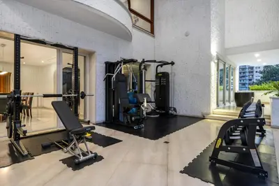 a gym with two treadmills and two tread machines at Stunning Luxury Penthouse with SPA and Concierge in Medellín