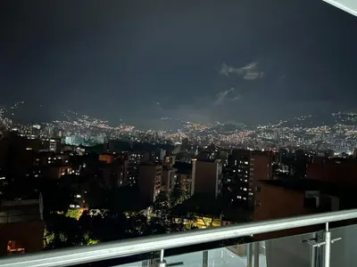 a view of a city at night at Hermoso y nuevo apartamento 2 in Medellín