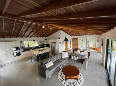a living room with a couch and a table at Modern mountain house in Las Palmas