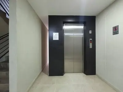 a hallway with a elevator in a building at Comfortable Apt Envigado 3 Rooms 5 Beds in Envigado