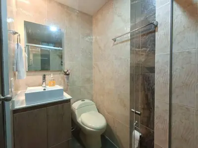 a bathroom with a toilet and a sink and a shower at Comfortable Apt Envigado 3 Rooms 5 Beds in Envigado