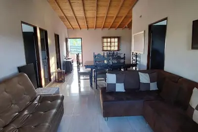 a living room with a couch and a table at Casa de campo in Jericó