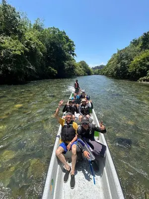 a group of people in a boat on a river at ECOHOTEL MONTEBELLO Norcasia Caldas in Confines